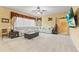 Cozy living room with a large sectional, neutral color palette, and lots of light at 11321 Ledgement Ln, Windermere, FL 34786