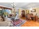 Ornately decorated living room with hardwood floors and lots of natural light at 11321 Ledgement Ln, Windermere, FL 34786