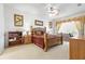 Serene main bedroom with a ceiling fan, natural light, and warm tones creating a relaxing retreat at 11321 Ledgement Ln, Windermere, FL 34786