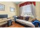Office features hardwood floors, large windows with nice drapes, and a comfortable couch at 11321 Ledgement Ln, Windermere, FL 34786