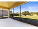 Screened patio with a view of the lake and lush backyard at 11321 Ledgement Ln, Windermere, FL 34786