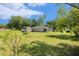 Expansive backyard featuring a shed, mature trees, and plenty of green space at 14285 Oconner Rd, Kathleen, FL 33849