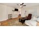 Open living room and kitchen featuring wood laminate floors and recessed lighting at 14285 Oconner Rd, Kathleen, FL 33849