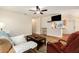 Inviting living room with an open layout, ceiling fan, and wood laminate flooring at 14285 Oconner Rd, Kathleen, FL 33849