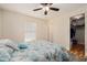 Comfortable bedroom featuring a ceiling fan, closet, and lots of natural light at 14285 Oconner Rd, Kathleen, FL 33849