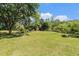 Spacious green lot with mature trees, offering privacy and natural beauty at 14285 Oconner Rd, Kathleen, FL 33849
