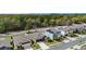 An aerial perspective showing the roof, lawn, driveway, and surrounding residential area at 1700 Red Loop, Lakeland, FL 33801