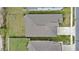 Aerial view of the home showcasing its roof, landscaping, and surrounding neighborhood at 1700 Red Loop, Lakeland, FL 33801