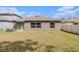 Spacious backyard featuring green grass, providing ample space for outdoor enjoyment and recreation at 1700 Red Loop, Lakeland, FL 33801