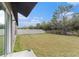 A large backyard with grass and a privacy fence, perfect for outdoor activities and relaxation at 1700 Red Loop, Lakeland, FL 33801