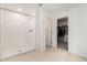 Bathroom with a tiled shower and tile floors leading to a walk-in closet for optimal storage at 1700 Red Loop, Lakeland, FL 33801