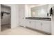 Bathroom with double sinks, granite countertops, and a walk in closet at 1700 Red Loop, Lakeland, FL 33801