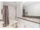 Well-lit bathroom with shower/tub combo featuring subway tile and a granite vanity top at 1700 Red Loop, Lakeland, FL 33801