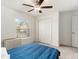 Bright bedroom with a ceiling fan, window for natural light, and a closet with louvered doors at 1700 Red Loop, Lakeland, FL 33801