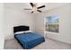 Cozy bedroom with plush carpet, ceiling fan, and a bright window with blinds at 1700 Red Loop, Lakeland, FL 33801
