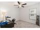 Well lit bedroom with a window and gray carpeting, showing a treadmill and desk at 1700 Red Loop, Lakeland, FL 33801