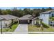 Charming home with a well-manicured lawn, and a welcoming entrance enhancing curb appeal at 1700 Red Loop, Lakeland, FL 33801