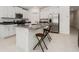 Open kitchen featuring granite island, stainless steel appliances, and ample cabinet space at 1700 Red Loop, Lakeland, FL 33801