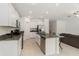 Modern kitchen with stainless steel appliances, granite counters, and an open layout at 1700 Red Loop, Lakeland, FL 33801