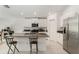 Spacious kitchen with granite countertops, stainless steel refrigerator, and white cabinetry at 1700 Red Loop, Lakeland, FL 33801