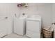 Convenient laundry room with washer, dryer, shelf and laundry basket for easy cleaning at 1700 Red Loop, Lakeland, FL 33801
