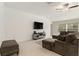Comfortable living room featuring a large sectional sofa, entertainment center, and natural light at 1700 Red Loop, Lakeland, FL 33801