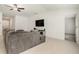 Cozy living room featuring a large sectional sofa and a wall-mounted television at 1700 Red Loop, Lakeland, FL 33801