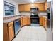 Stylish kitchen features stainless steel appliances, tile floors and ample cabinet space at 231 4Th St, Winter Haven, FL 33880
