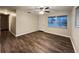 Bright living room with wood-look floors, complemented by natural light from a window at 231 4Th St, Winter Haven, FL 33880