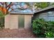 Exterior view of the shed with siding, offering additional storage and utility space at 231 4Th St, Winter Haven, FL 33880
