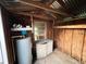 Interior view of the shed featuring a window and shelving for organized storage at 231 4Th St, Winter Haven, FL 33880