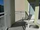 Comfortable balcony seating area to enjoy the outdoors at 3151 Sunset Walk Dr # 314, Kissimmee, FL 34747