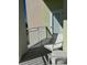 Open-air balcony featuring a white chair and small table at 3151 Sunset Walk Dr # 314, Kissimmee, FL 34747