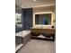 Upscale bathroom featuring a soaking tub and stylish double vanity with an LED mirror at 3151 Sunset Walk Dr # 314, Kissimmee, FL 34747