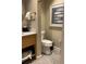 Cozy bathroom featuring a toilet and framed fish artwork above the commode at 3151 Sunset Walk Dr # 314, Kissimmee, FL 34747