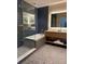 Stylish bathroom featuring a soaking tub, shower, and illuminated mirror over a modern vanity at 3151 Sunset Walk Dr # 314, Kissimmee, FL 34747