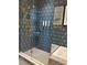 Stylish bathroom featuring a glass-enclosed shower, luxury bath products, and elegant gold fixtures at 3151 Sunset Walk Dr # 314, Kissimmee, FL 34747