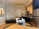 Contemporary kitchen features a spacious island, modern appliances, and breakfast bar at 3151 Sunset Walk Dr # 314, Kissimmee, FL 34747