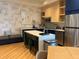 Modern kitchen with an island, stainless steel appliances, and stylish cabinetry at 3151 Sunset Walk Dr # 314, Kissimmee, FL 34747