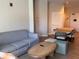 Comfortable living room with sofa, coffee table, and dining area, perfect for relaxation at 3151 Sunset Walk Dr # 314, Kissimmee, FL 34747