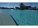Large community pool with multiple seating options and lush landscaping at 3151 Sunset Walk Dr # 314, Kissimmee, FL 34747