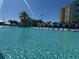 Large community pool with various seating areas and vibrant surroundings at 3151 Sunset Walk Dr # 314, Kissimmee, FL 34747