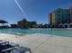 Beautiful community swimming pool with lounge chairs and inviting cabanas at 3151 Sunset Walk Dr # 314, Kissimmee, FL 34747