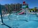 Gathering-friendly water park with splash pad and resort buildings in background at 3151 Sunset Walk Dr # 314, Kissimmee, FL 34747