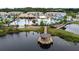 Aerial view of the community pool and recreation area with a lake and gazebo at 168 Claffey Ct, Haines City, FL 33844