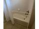Bathroom featuring a clean white tub and a shower with bronze fixtures at 168 Claffey Ct, Haines City, FL 33844