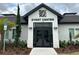 Elegant event center with modern architectural design, enhanced by professional landscaping, for memorable gatherings at 168 Claffey Ct, Haines City, FL 33844