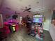 A community center game room featuring modern arcade games, air hockey and vibrant decor for interactive Gathering entertainment at 168 Claffey Ct, Haines City, FL 33844
