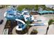 Blue and white water slide with winding turns offers thrilling fun at the community's aquatic park at 168 Claffey Ct, Haines City, FL 33844