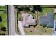 Aerial view of a home with a neutral-toned roof, showcasing its layout and surrounding yard at 1743 Wilshire Ct, Lakeland, FL 33813